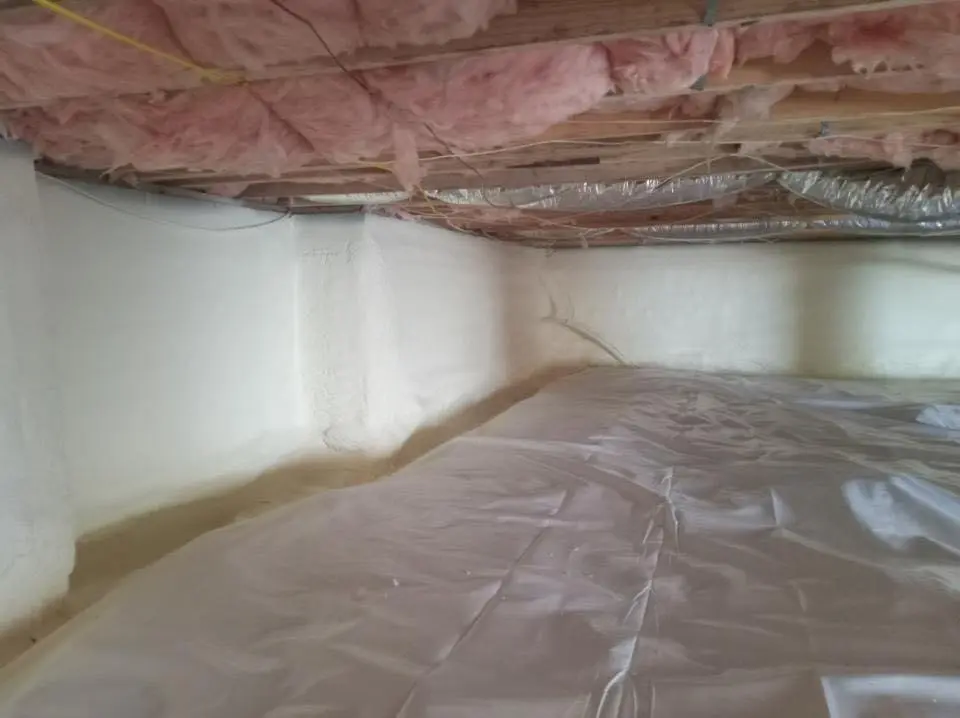 Crawl space encapsulation with closed-cell spray foam for Commercial Roof Restoration in Delano